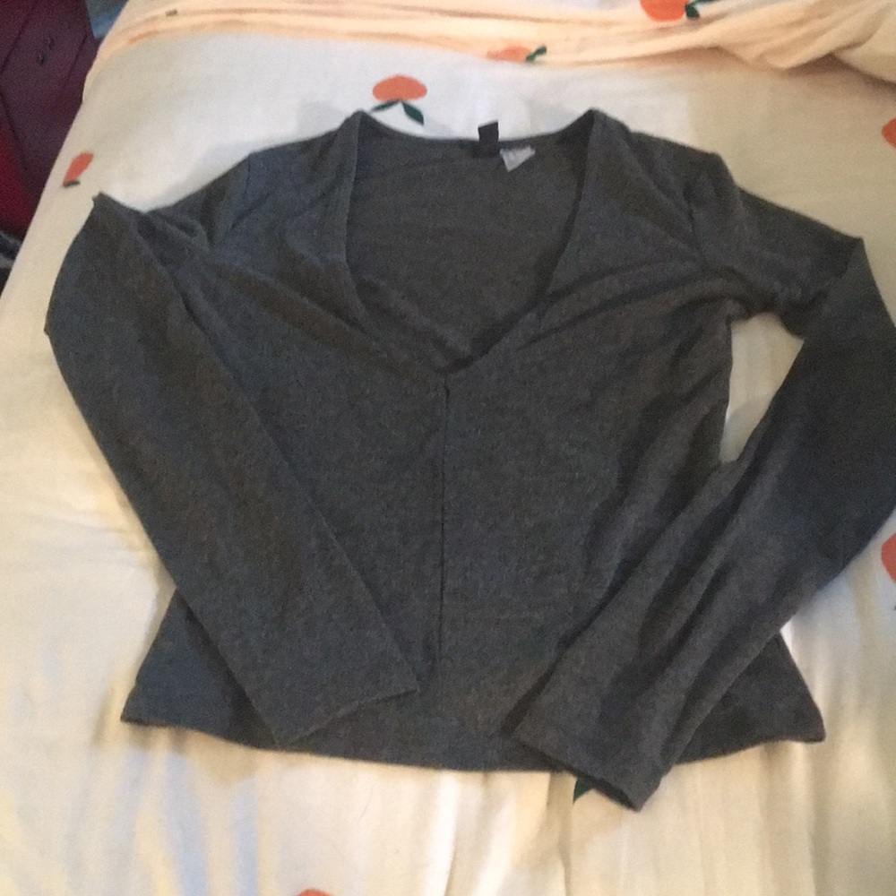 Long sleeved gray shirt.
